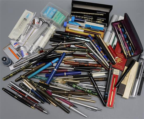 A quantity of fountain pens and writing equipment